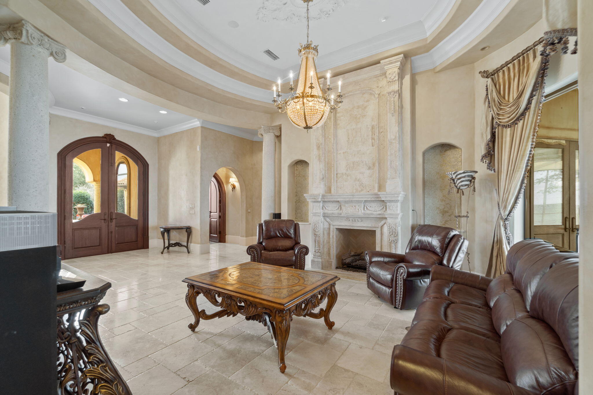 456 Captains Circle Destin, FL 32541 - Photo 8 of 85 a living room with furniture a fireplace and chandelier