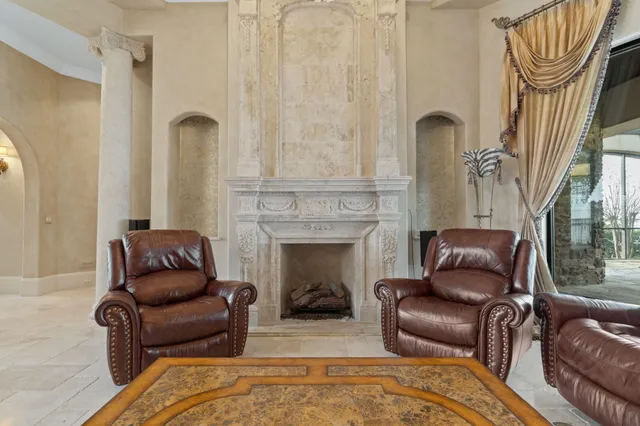 a bedroom with a large bed and a large window