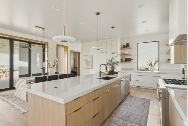923 North Emery Lane Elk Ridge, UT 84651 - Photo 17 of 101 Spacious kitchen featuring a large central island with light wood-finish cabinetry and a white countertop