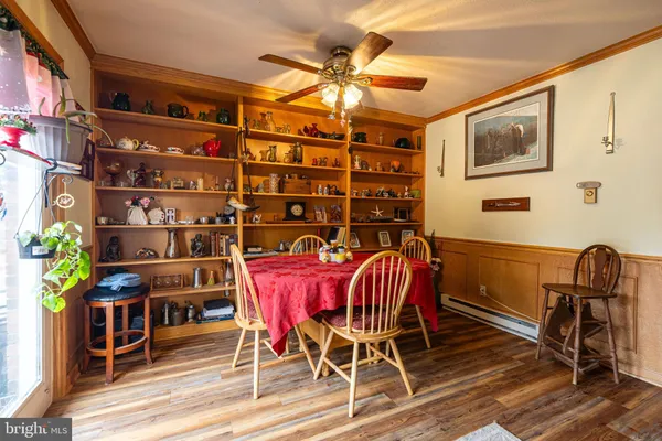 a very nice looking dining room with a large window
