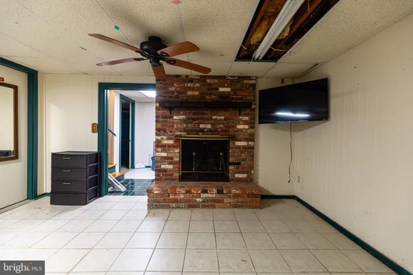 a kitchen with a refrigerator and a stove