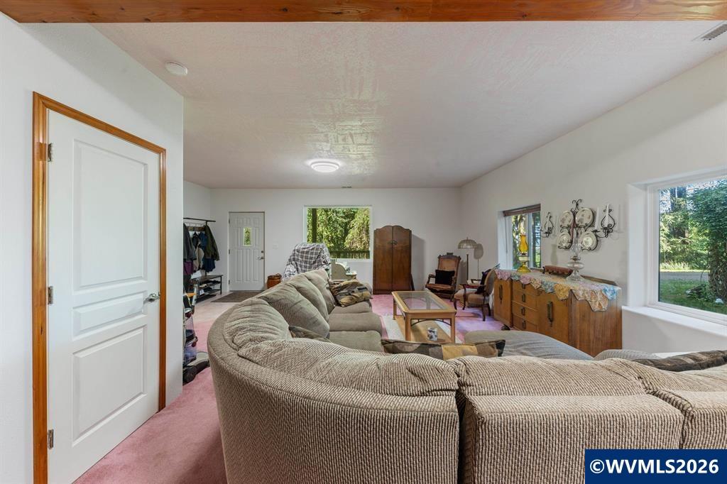 6100 Teal Creek Road Dallas, OR 97338 - Photo 25 of 41 a living room with furniture and a window