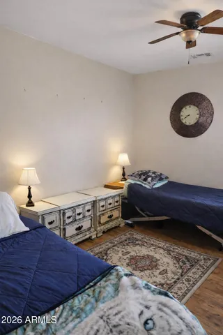 a bedroom with a bed and a table