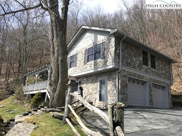 a front view of a house with garage