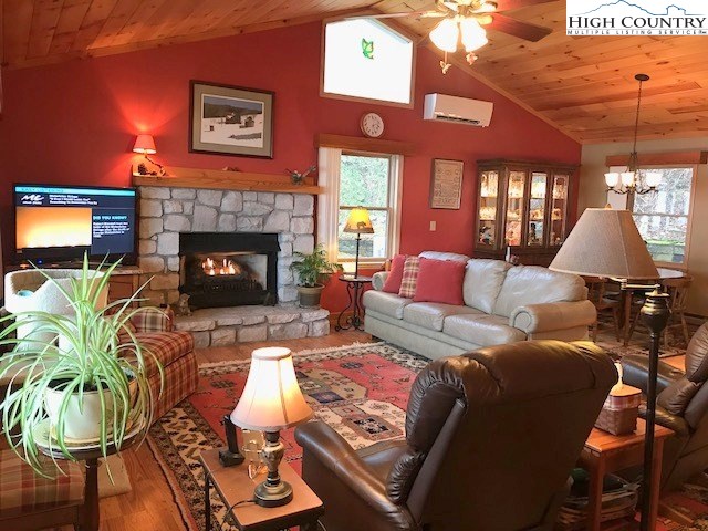 990 Fox Meadow Road Banner Elk, NC 28604 - Photo 16 of 45 a living room with furniture and a fireplace