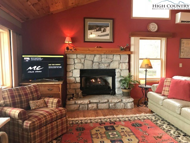 990 Fox Meadow Road Banner Elk, NC 28604 - Photo 17 of 45 a living room with furniture and a fireplace