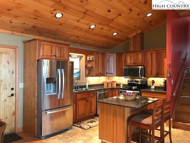 990 Fox Meadow Road Banner Elk, NC 28604 - Photo 20 of 45 a kitchen with refrigerator cabinets and a sink