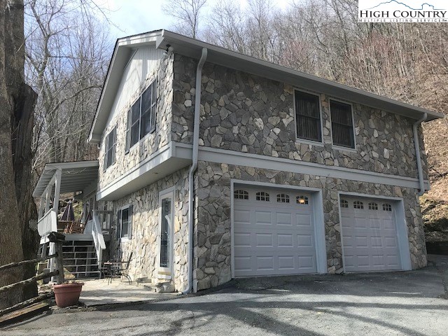 990 Fox Meadow Road Banner Elk, NC 28604 - Photo 2 of 45 a front view of a building with a street