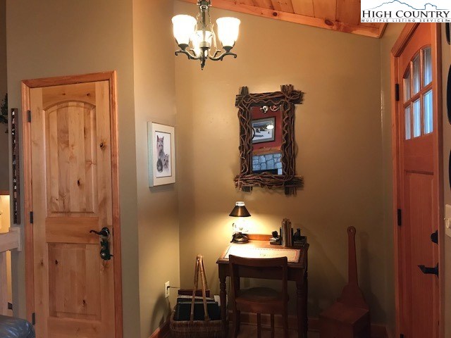990 Fox Meadow Road Banner Elk, NC 28604 - Photo 23 of 45 a bathroom with a sink a mirror and a shower