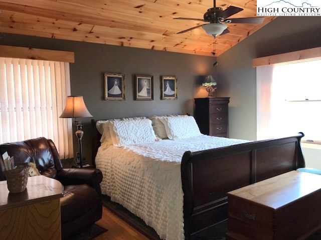 990 Fox Meadow Road Banner Elk, NC 28604 - Photo 25 of 45 a bedroom with furniture and wooden floor