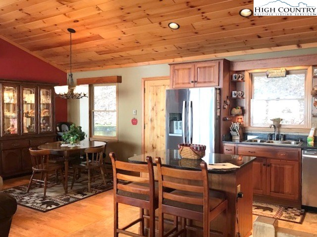990 Fox Meadow Road Banner Elk, NC 28604 - Photo 28 of 45 a view of a dining room with furniture window and outside view