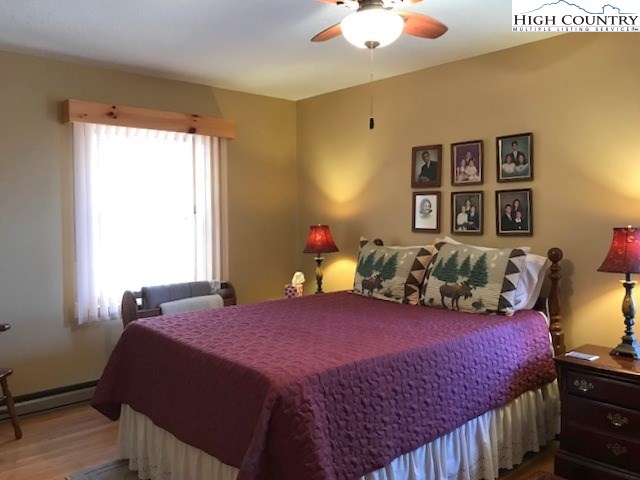 990 Fox Meadow Road Banner Elk, NC 28604 - Photo 31 of 45 a bedroom with a large bed and a window