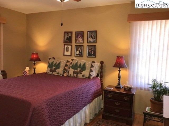990 Fox Meadow Road Banner Elk, NC 28604 - Photo 32 of 45 a bed room with a bed and a couch