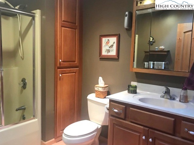 990 Fox Meadow Road Banner Elk, NC 28604 - Photo 33 of 45 a bathroom with a sink a toilet and shower