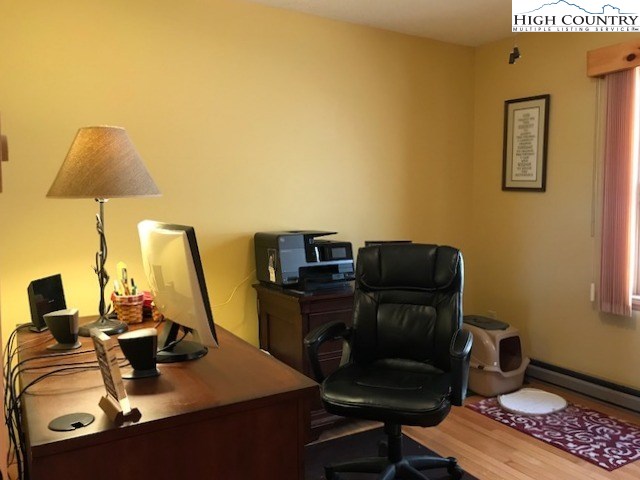 990 Fox Meadow Road Banner Elk, NC 28604 - Photo 34 of 45 a view of a workspace with furniture and a window