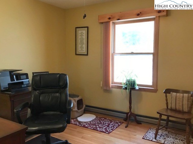 990 Fox Meadow Road Banner Elk, NC 28604 - Photo 35 of 45 a view of workspace with wooden floor windows