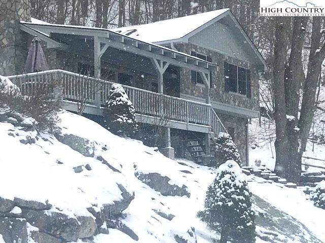 990 Fox Meadow Road Banner Elk, NC 28604 - Photo 9 of 45 a view of a house with a wooden fence
