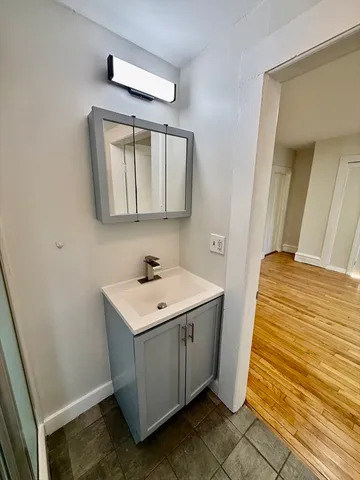 a bathroom with a sink and a mirror