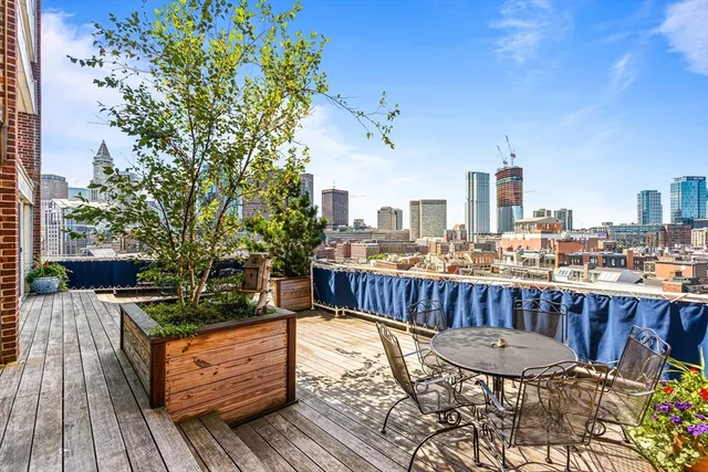a view of a roof deck with couches