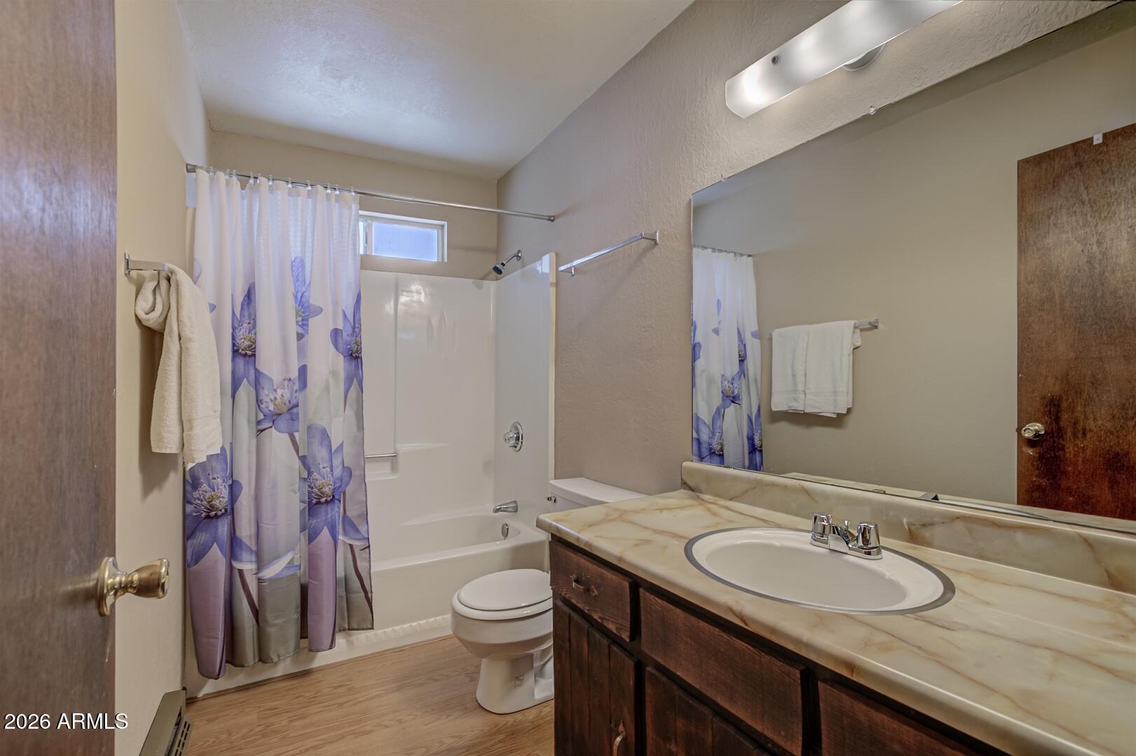 3741 Cochise Lane Pine, AZ 85544 - Photo 14 of 21 a bathroom with a granite countertop sink toilet and shower
