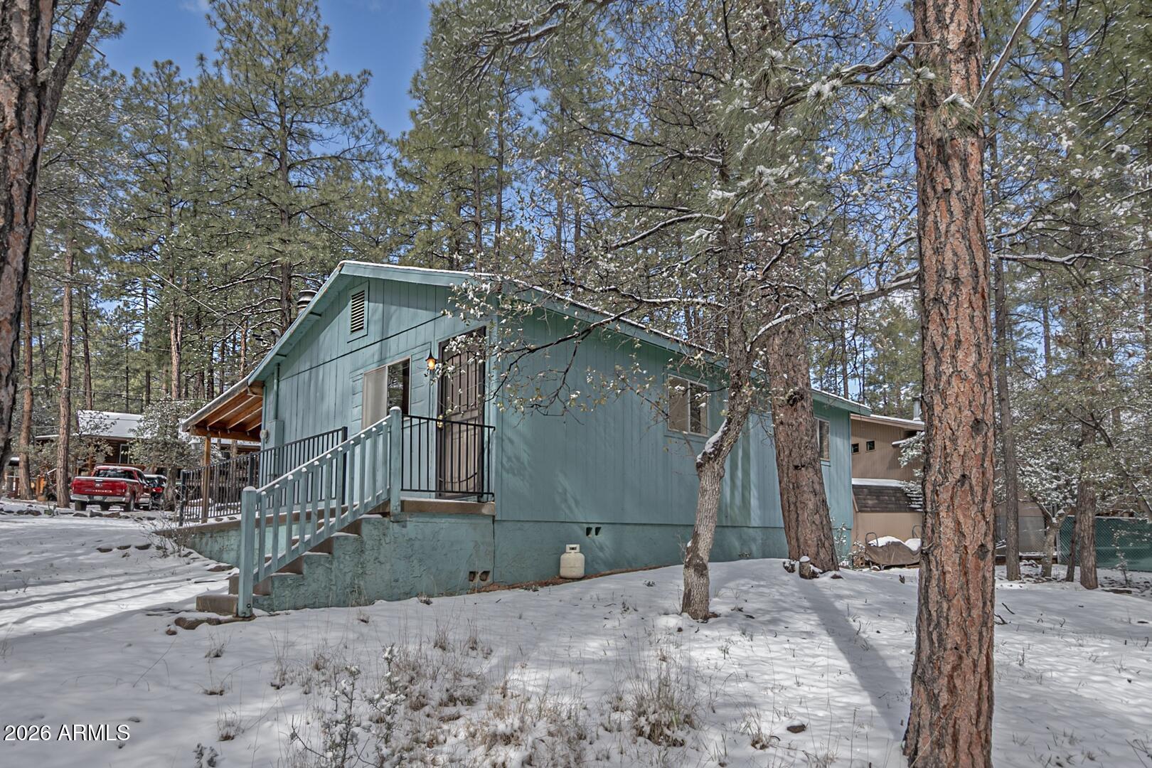 3741 Cochise Lane Pine, AZ 85544 - Photo 18 of 21 a view of a house with a yard