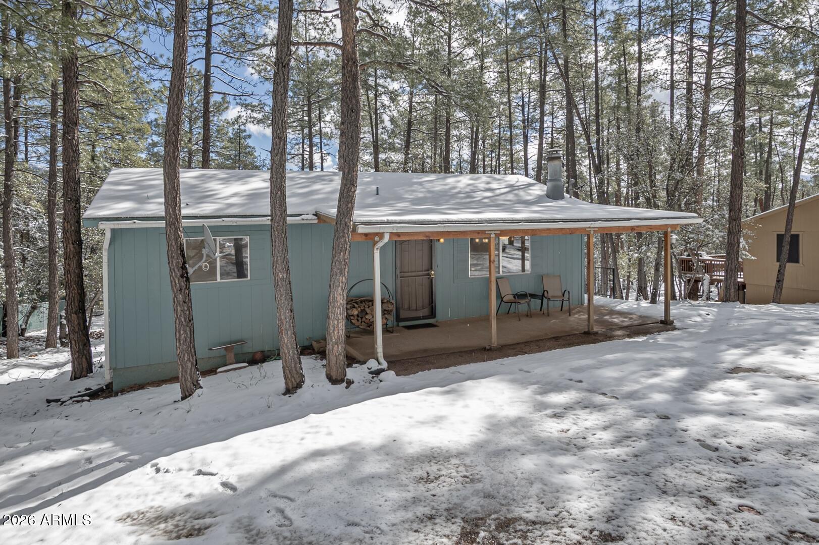 3741 Cochise Lane Pine, AZ 85544 - Photo 21 of 21 a view of a house with backyard porch and sitting area