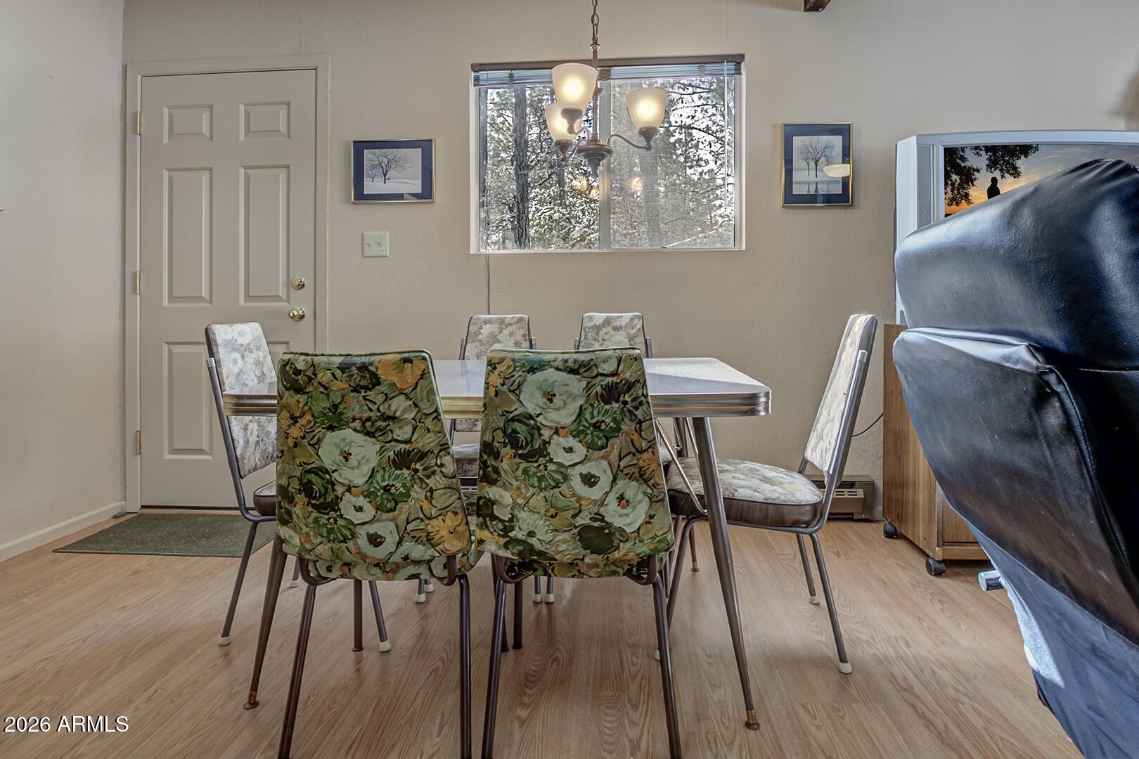 3741 Cochise Lane Pine, AZ 85544 - Photo 7 of 21 a view of a dining room with furniture and wooden floor