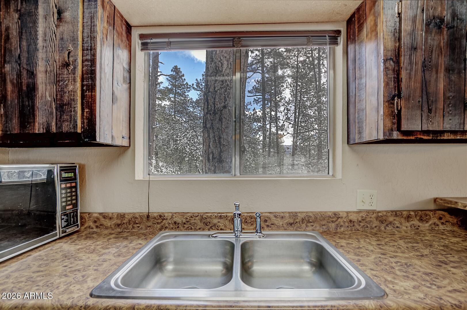 3741 Cochise Lane Pine, AZ 85544 - Photo 10 of 21 a kitchen with a sink and cabinets