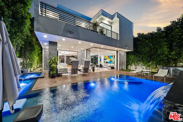 a view of swimming pool with outdoor seating