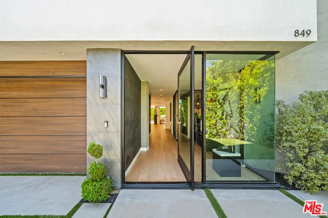 an entryway with wooden floor