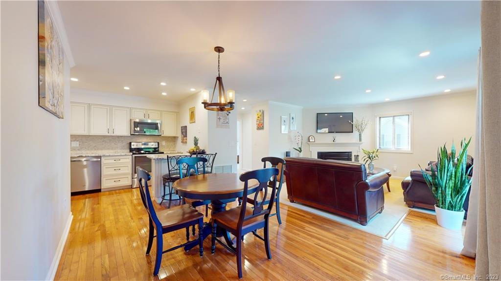 20 Maple Tree Avenue, Unit C Stamford, CT 06906 - Photo 1 of 1 a view of a dining room with furniture and wooden floor