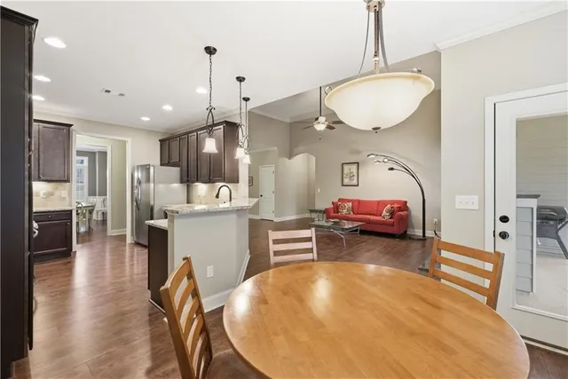 a view of kitchen and dining area with furniture