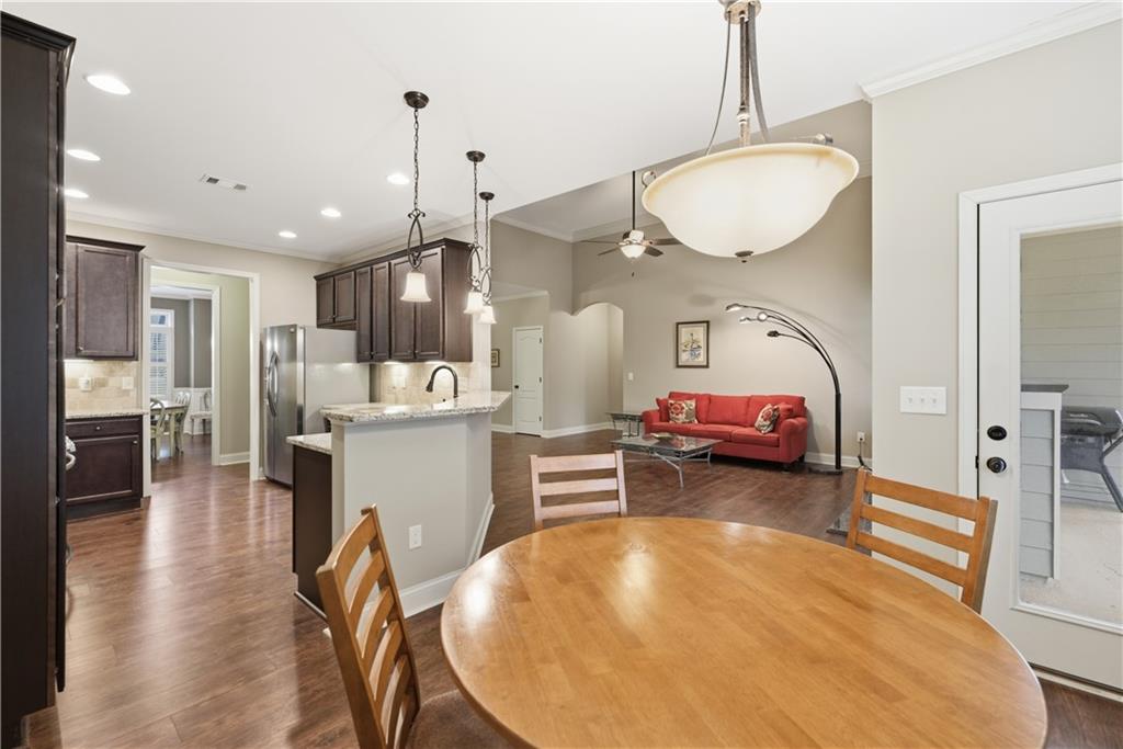 308 Morning Frost Canton, GA 30114 - Photo 14 of 41 a view of kitchen and dining area with furniture