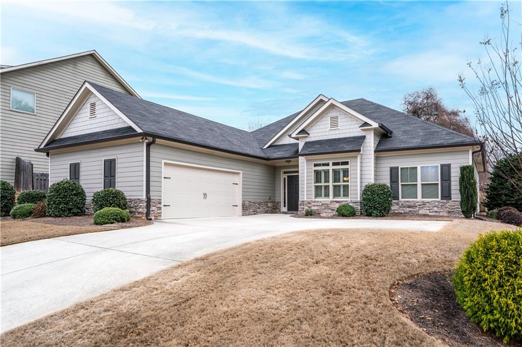 308 Morning Frost Canton, GA 30114 - Photo 2 of 41 a front view of a house with a yard