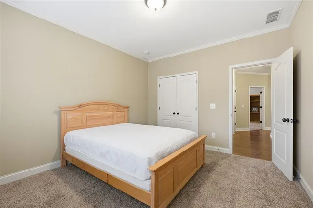 a bedroom with a bed and closet