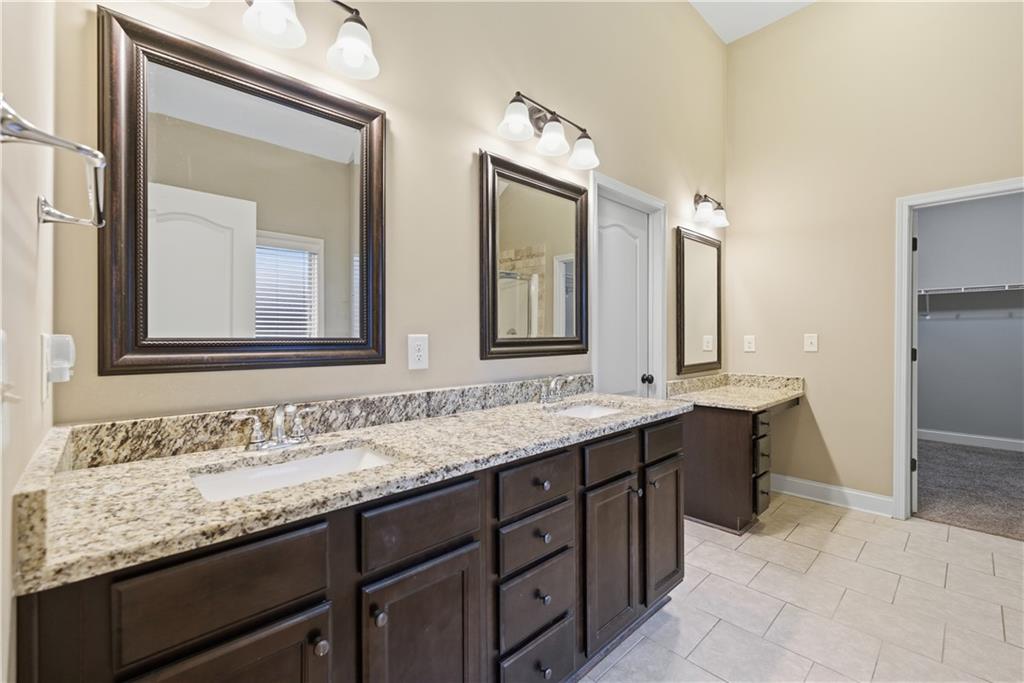 308 Morning Frost Canton, GA 30114 - Photo 27 of 41 a bathroom with double sink and a mirror
