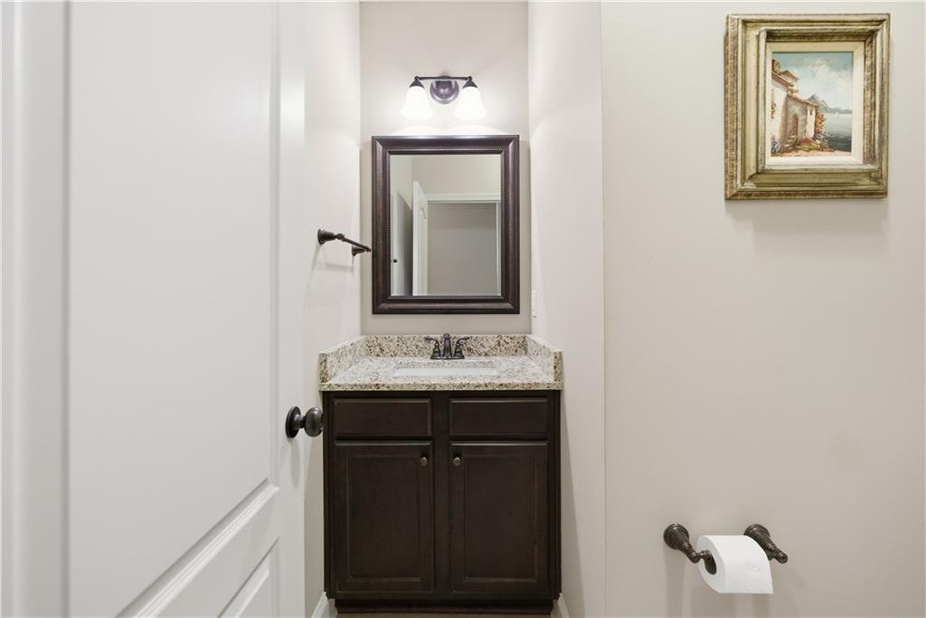 308 Morning Frost Canton, GA 30114 - Photo 32 of 41 a bathroom with a sink and a mirror
