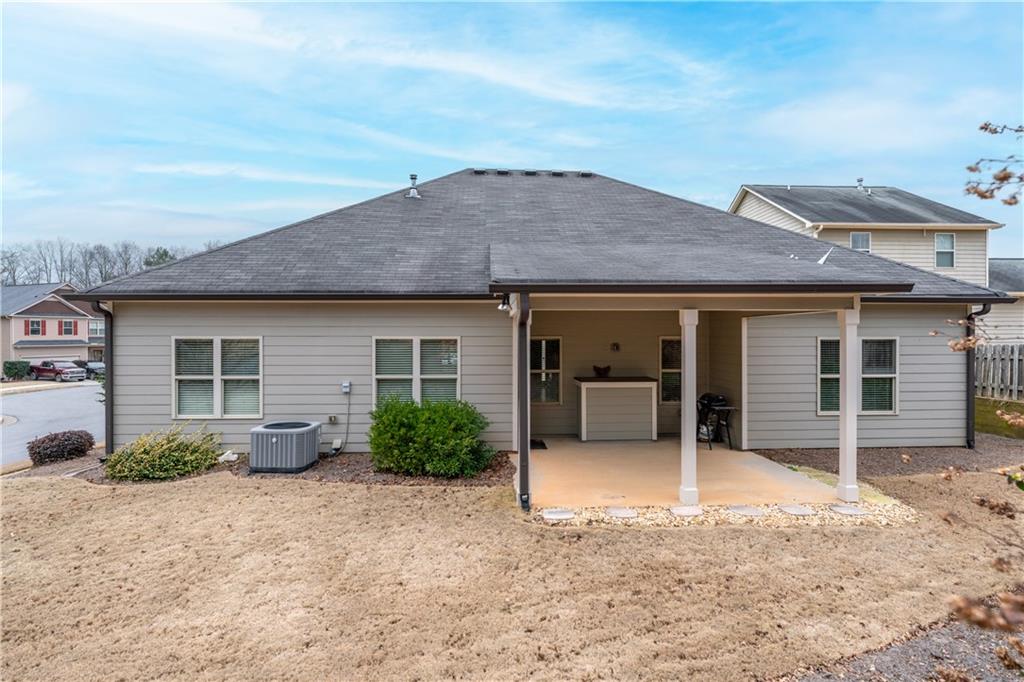 308 Morning Frost Canton, GA 30114 - Photo 34 of 41 a front view of a house with a yard and garage