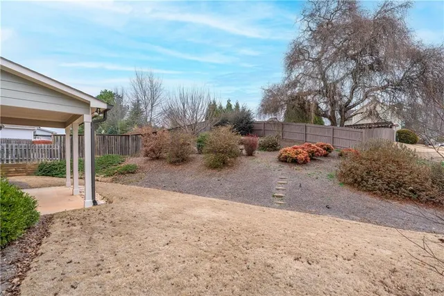a view of a yard with tiny house