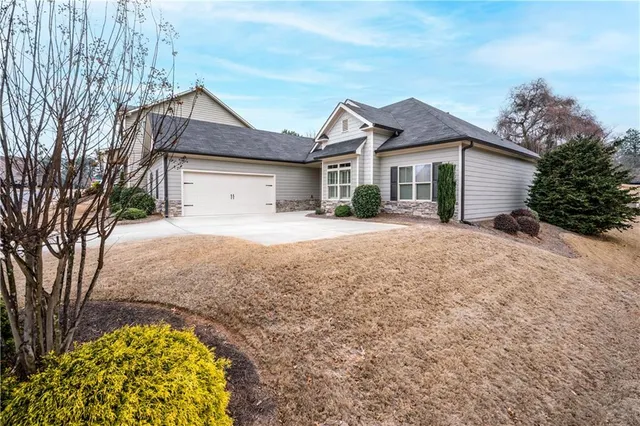 a front view of a house with a yard