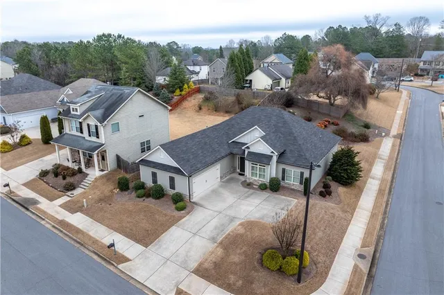 an aerial view of a house with a swimming pool