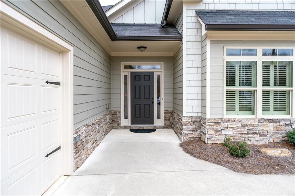 308 Morning Frost Canton, GA 30114 - Photo 4 of 41 a front view of a house with a yard