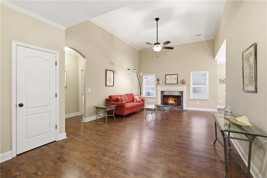 308 Morning Frost Canton, GA 30114 - Photo 8 of 41 a living room with furniture fireplace and a chandelier