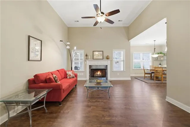 a living room with furniture fireplace and window