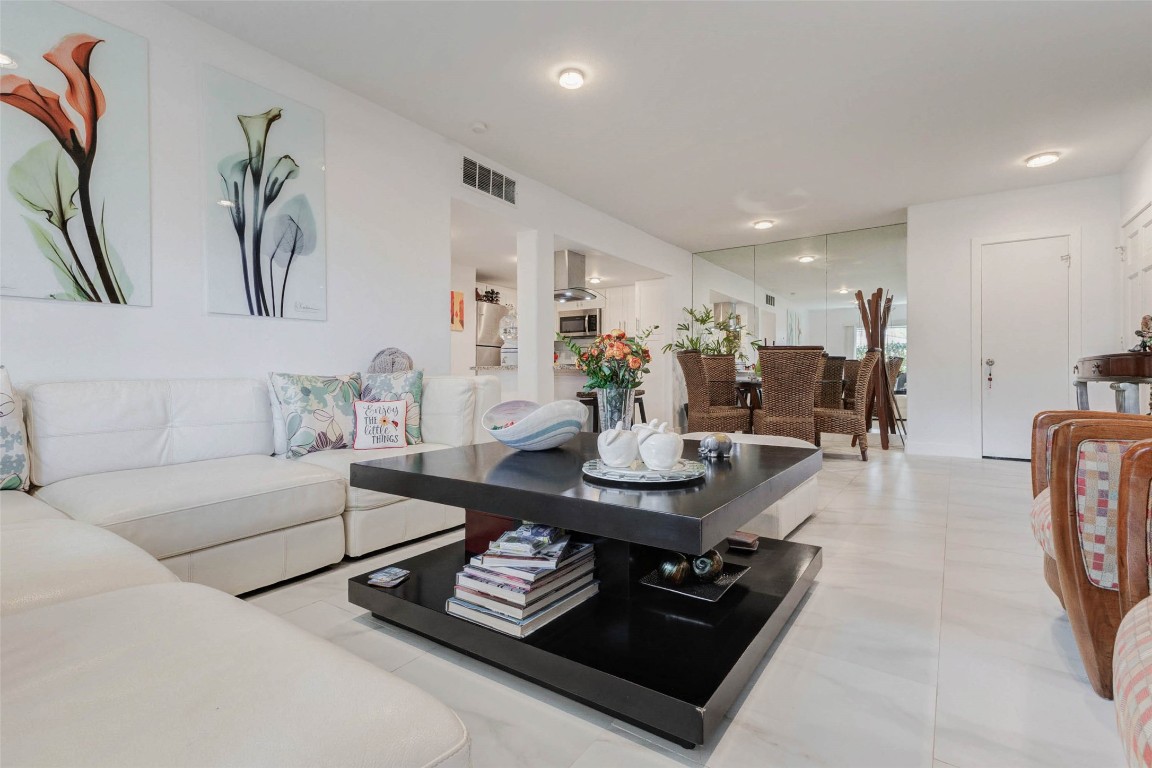 2234 South Piney Point Road, Unit 110 Houston, TX 77063 - Photo 11 of 25 This inviting living space features a spacious, open layout with modern decor complemented with a polished flooring for a bright, airy feel.