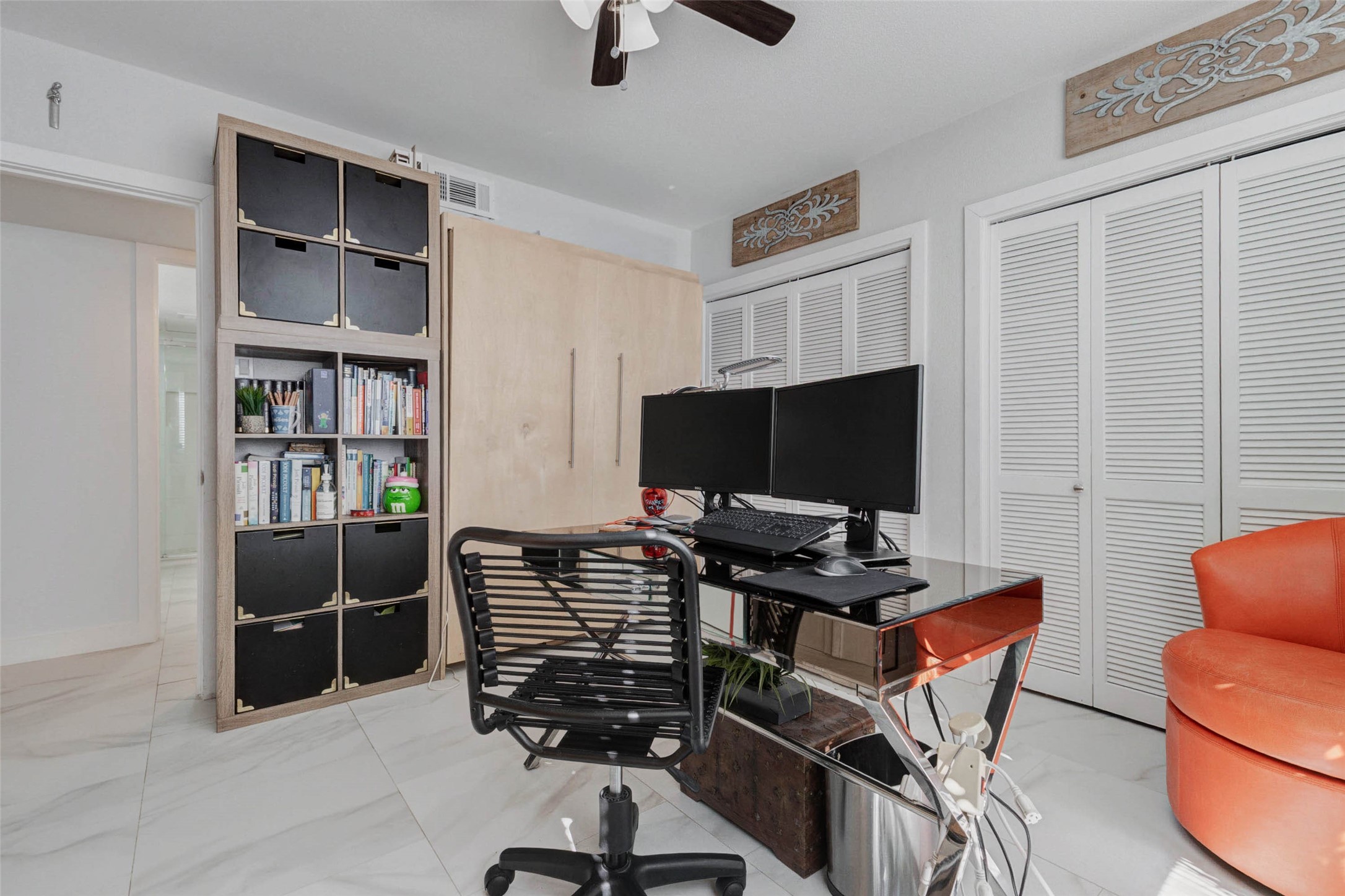 2234 South Piney Point Road, Unit 110 Houston, TX 77063 - Photo 13 of 25 This room functions as a modern home office.