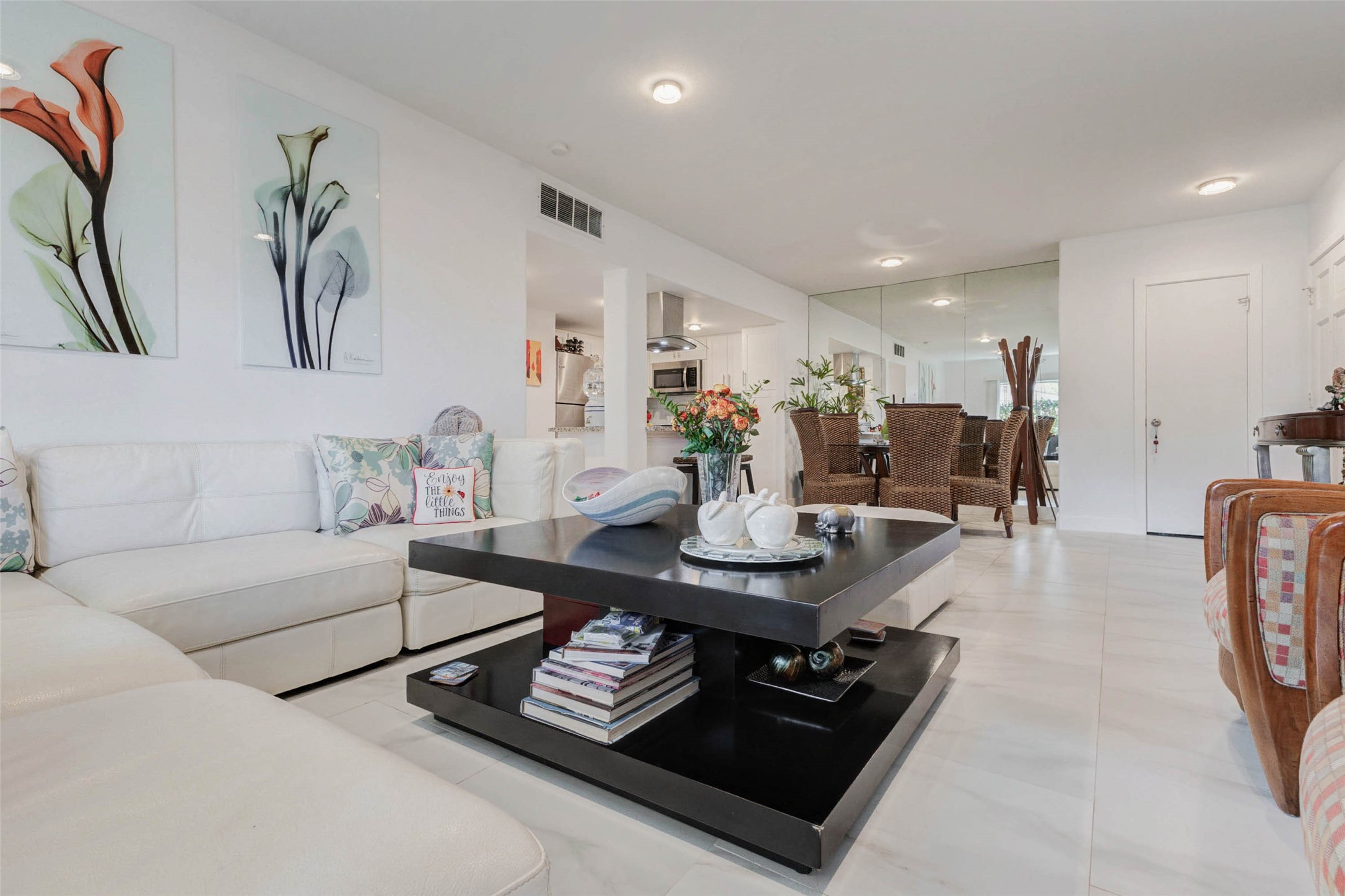2234 South Piney Point Road, Unit 110 Houston, TX 77063 - Photo 9 of 25 This inviting living space features a spacious, open layout with modern decor complemented with a polished flooring for a bright, airy feel.
