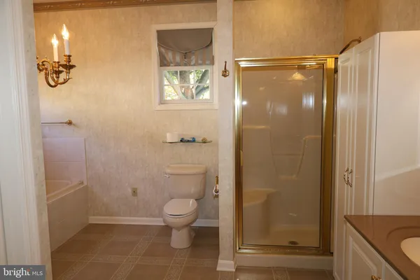 a view of granite countertop white cabinets and sink