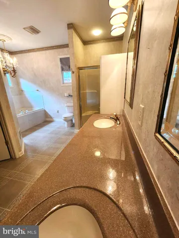 a bathroom with a sink and shower