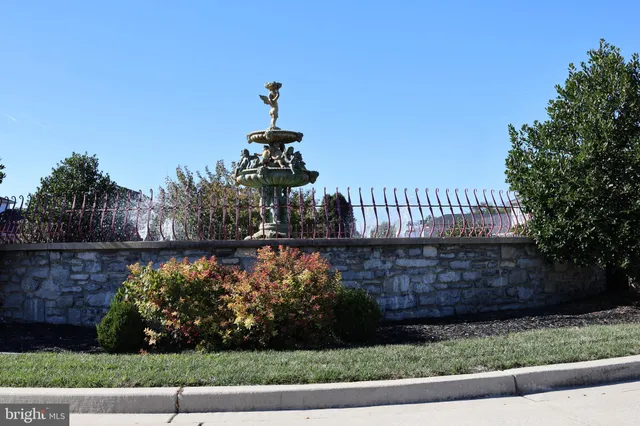 a view of outdoor space with garden and trees